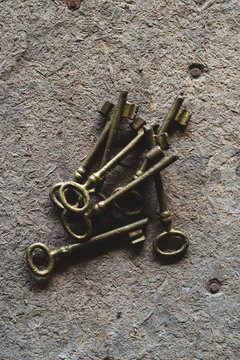 Old keys on wooden surface