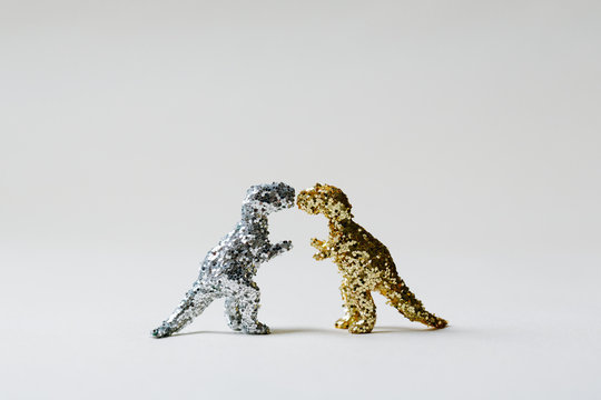 Silver Glitter T Rex and Gold Glitter T Rex Face Off