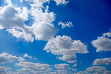 Naklejka na ściany i meble White clouds on the background of the blue sky