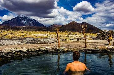 geothermal pools with a view to a snow capped volcano