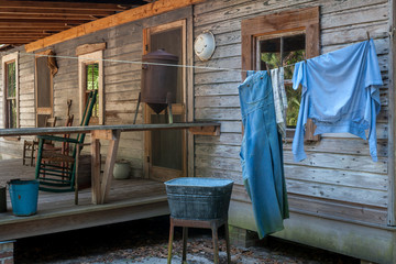 Clothes hanging outside a rustic cabin in a park