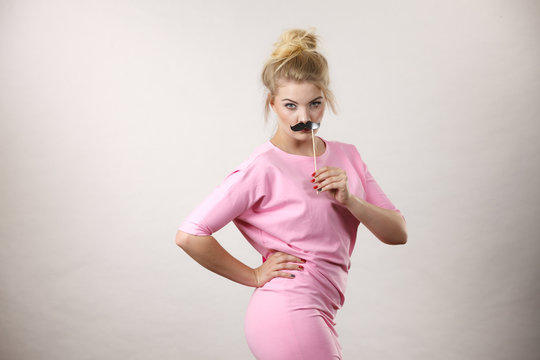 Happy Woman Holding Fake Moustache On Stick