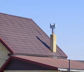 The roof of corrugated sheet. Brown corrugated metal profile roo
