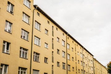 Fototapeta na wymiar orange apartment buildings on a cloudy day