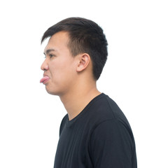 Fototapeta premium Asian young man showing tongue isolated on white background with clipping path. envious and insult emotions concept