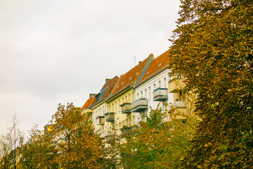 apartment buildings exterior in vintage colors on a cloudy day
