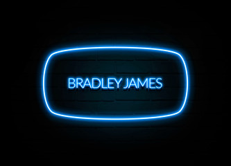 Bradley James  - colorful Neon Sign on brickwall