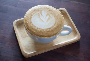 Hot coffee lifestyle on the wooden table in white cup