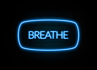 Breathe  - colorful Neon Sign on brickwall