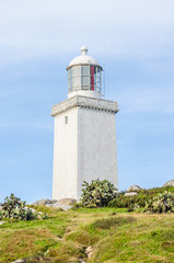 light house over the hill and blue sky