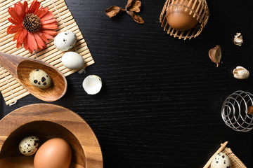 Fototapeta na wymiar studio shot of eggs on a black wooden background.