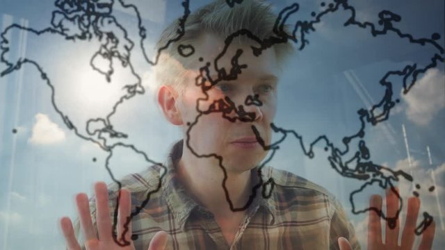 Reflection of a man looking at an outline of the world