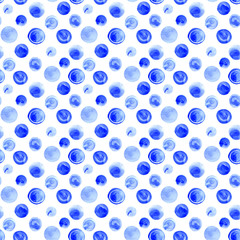 Seamless hand drawn watercolor pattern made of round blue dots, isolated over white.