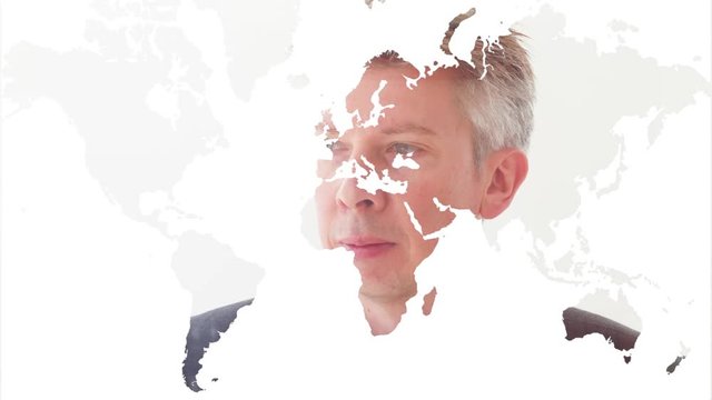 Reflection of a businessman looking at an image of the world