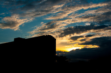 Fototapeta premium Silhouette building at sunset.