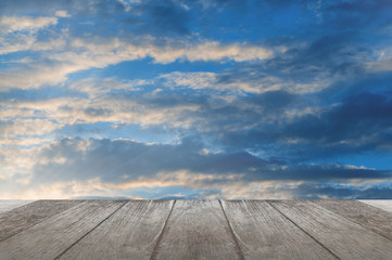 Wooden board with clouds and sky.