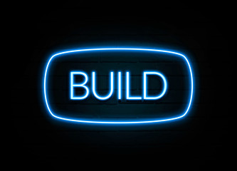 Build  - colorful Neon Sign on brickwall