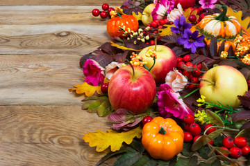 Thanksgiving decoration with yellow, pink and purple flowers, copy space