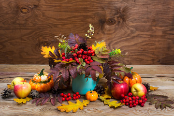 Thanksgiving centerpiece with rowan  in turquoise vase, copy space
