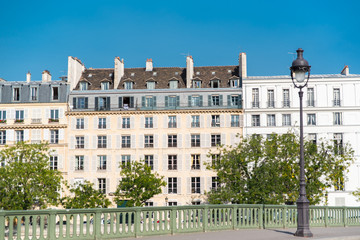 Paris, view of beautiful facades ile Saint-Louis, panorama from the Sully bridge
