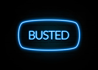 Busted  - colorful Neon Sign on brickwall