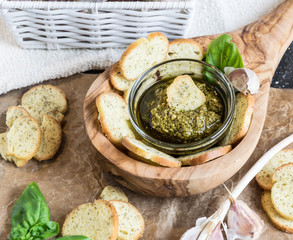 Crispy home-made basil bruschetta with basil pesto