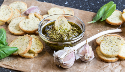 Crispy home-made basil bruschetta with basil pesto