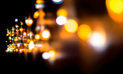 Christmas, celebration concept: blurred colorful lights on dark background
