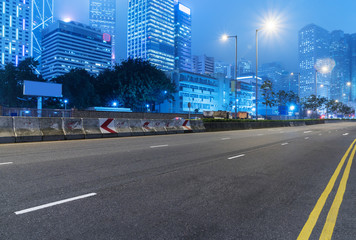inner city street with modern skyscrapers on background,hong kong,China.
