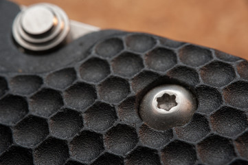 Closeup metal screw (bolt) and nuts.