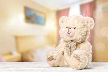 Obraz premium Teddy Bear toy alone on wood