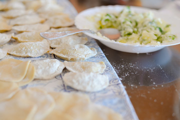 Close up of ravioli on table background tasty traditional food. Fresh dumplings cooking preparation