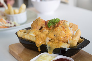 French fries cheese with juicy cheese on topping.