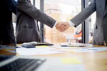businessman shaking hands finishing up a meeting,acquisition concept.