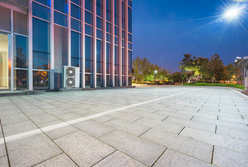 modern glass building exterior with empty pavement,copy space,shanghai,china.