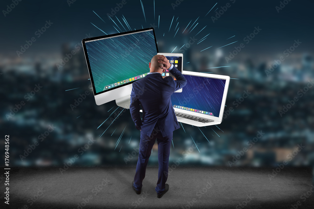 Poster businessman in front of a wall with computer and devices displayed on a futuristic interface - multi