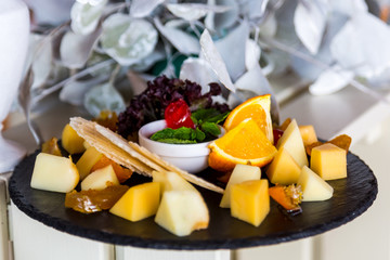 Cutting of cheese on a banquet table, beautifully served banquet table