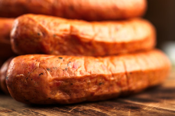 Deliciously smoked handmade Swedish Isterband sausages with natural casing. Here seen in close detail with shallow focus.
