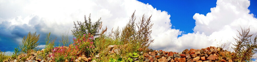 Panoramic view of boulders and clouds