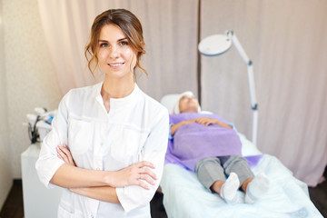 Cosmetologist, portrait of a beautician doctor on the background of the office