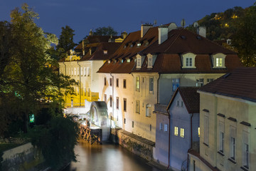 Fototapeta na wymiar Certovka and Kampa island at night in Prague. View from the Charles Bridge.