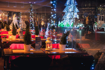 Fototapeta na wymiar KRAKOW, POLAND - DECEMBER 22, 2016: Restaurant Christmas decorations at the Krakow's Main Square.
