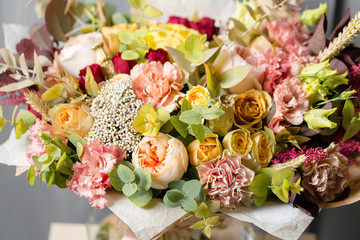 Flower composition on a gray background. Wedding and Festive decor. Bouquet from spring flowers. closeup