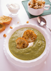Delicious green mashed soup. With broccoli and Brussels sprouts. Served with fried croutons and sour cream