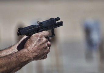 Handgun under recoil