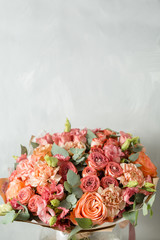 Flower composition on a gray background. Wedding and Festive decor. Powdery pink color. copy space. closeup
