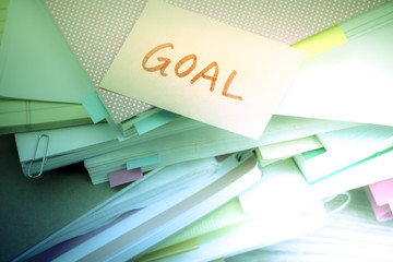 Goal; The Pile of Business Documents on the Desk