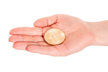 Golden Bitcoin in a man hand. Digitall symbol of a new virtual currency.