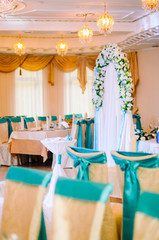 Wedding decor .Arch for carrying out of painting . beautiful wedding feather