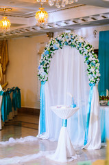 Wedding decor .Arch for carrying out of painting . beautiful wedding feather